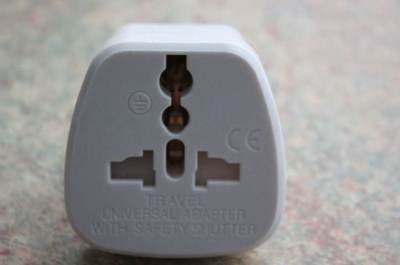 Photo of Universal Socket US USA America EU European AUS to UK 3 Pin Plug