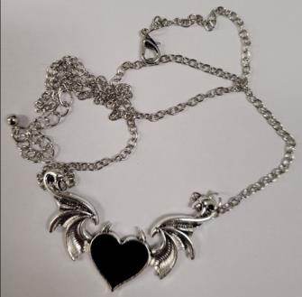 Photo of Counterfeit Alchemy Gothic Necklace and Moon & Star Dangle Earring sold via Amazon