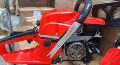 Photo of Red Gasoline Chainsaw