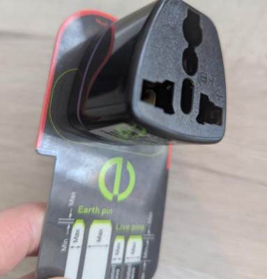 Photo of Shen Zhen San Zhi Electric Company Limited Black Travel Adaptor sold via TikTok