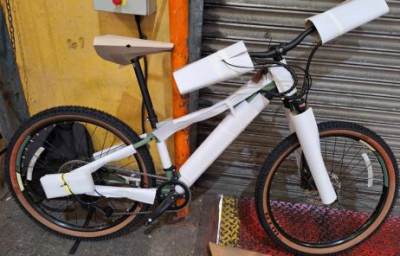 Photo of EZEGO TD10 E-Bike and EZEGO Lithium-Ion Battery Charger